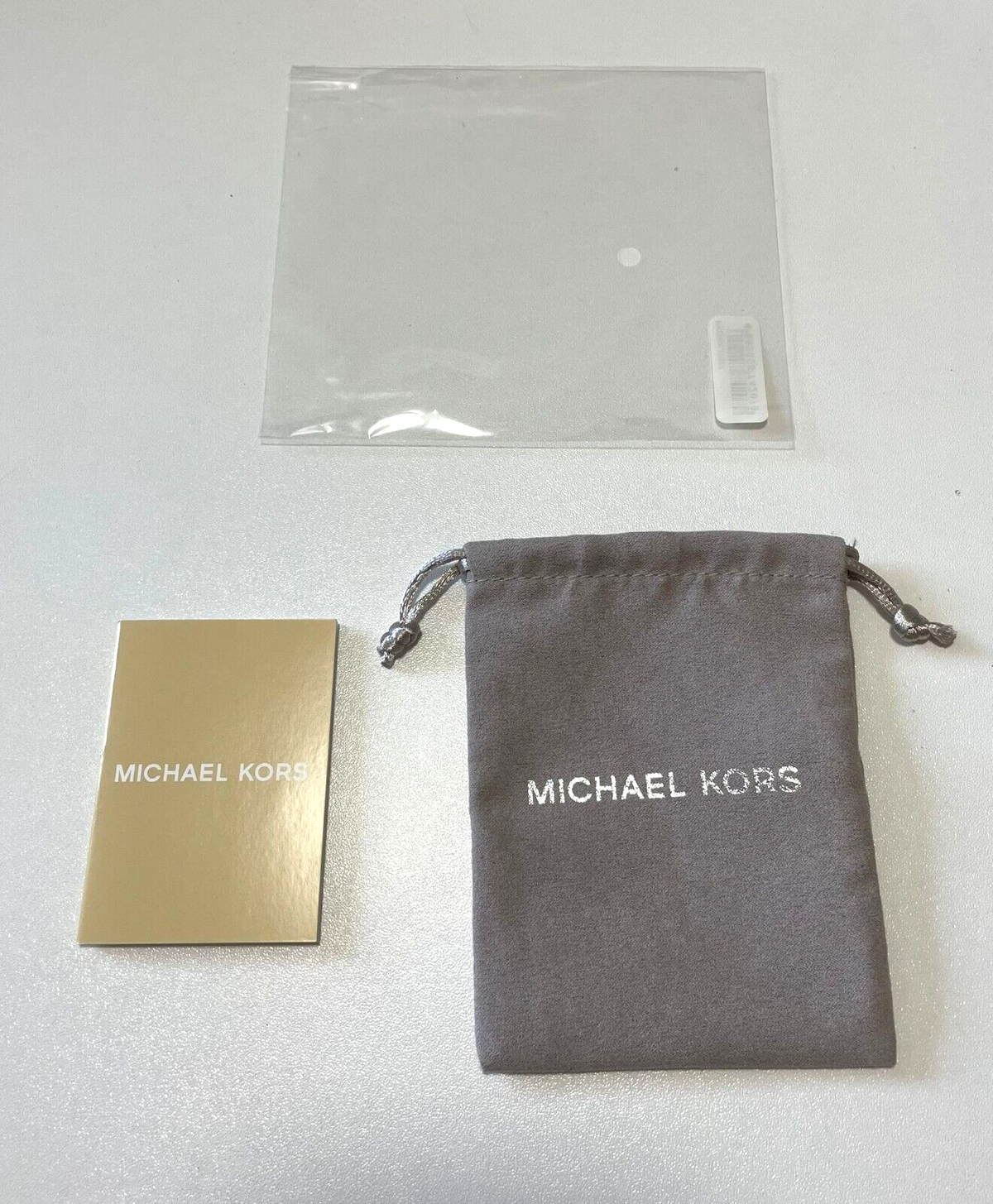 Bolsa de regalo de joyería Michael Kors con folleto